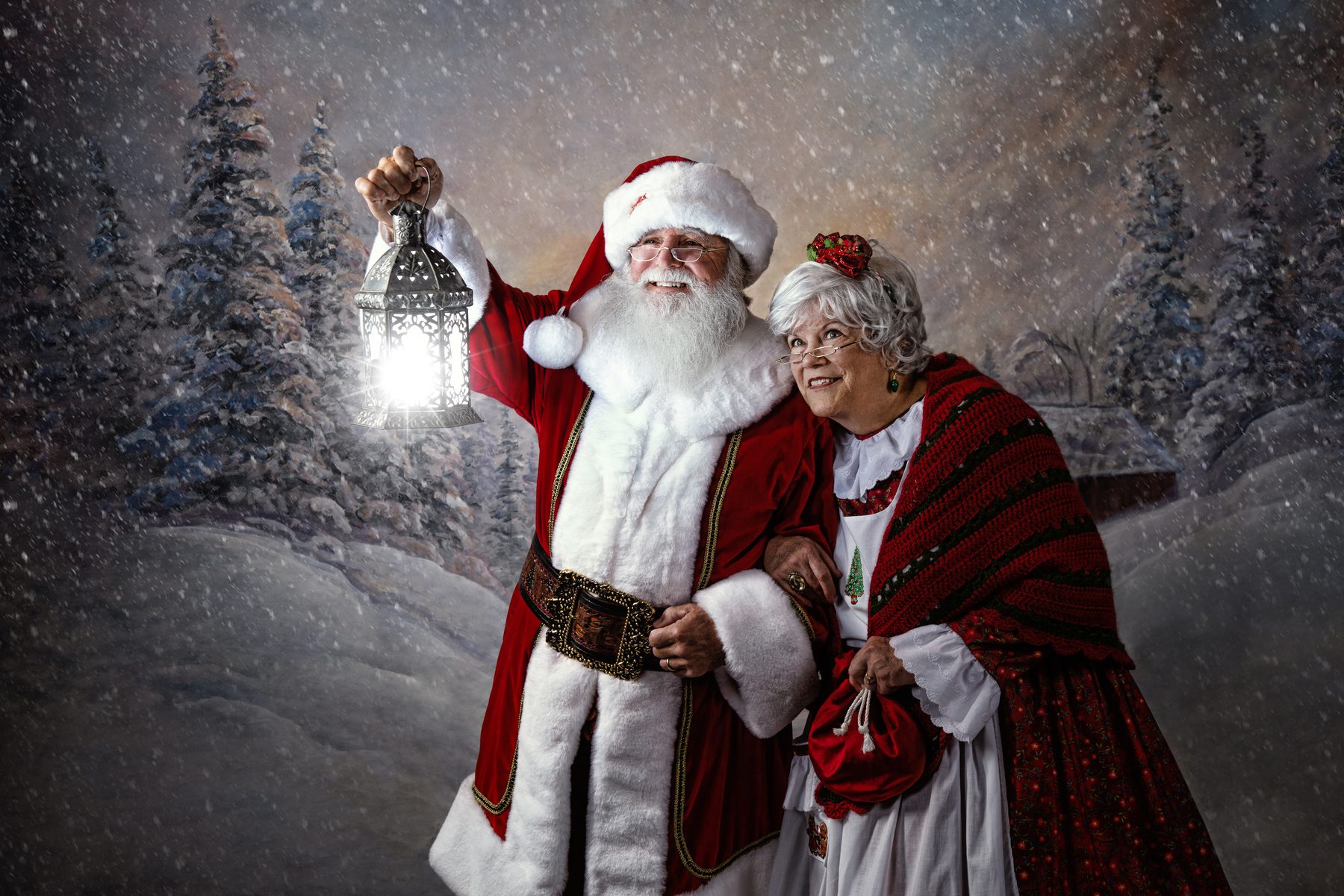 Santa and Mrs. Claus in a Christmas snow portrait